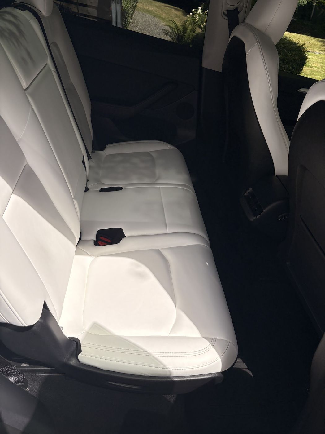 White Tesla rear bench after an interior detail